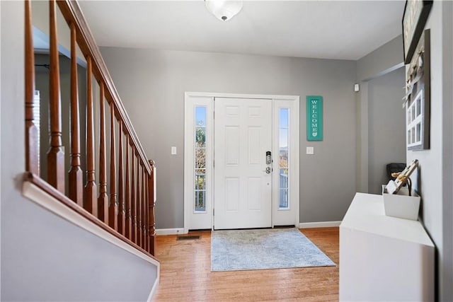 foyer with light hardwood / wood-style floors