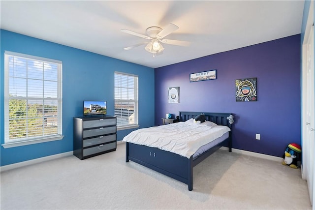 carpeted bedroom with ceiling fan