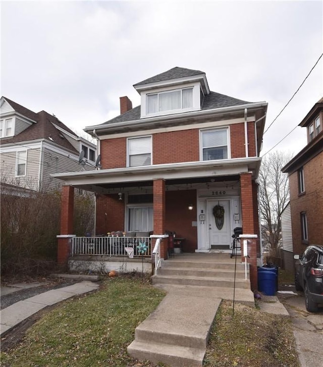 front facade with a porch