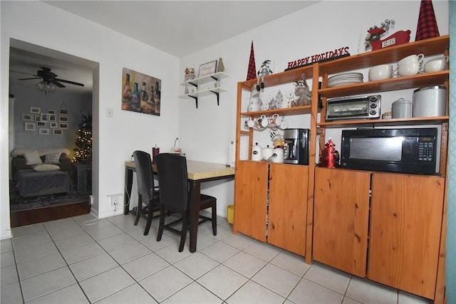 kitchen with ceiling fan and light tile patterned floors