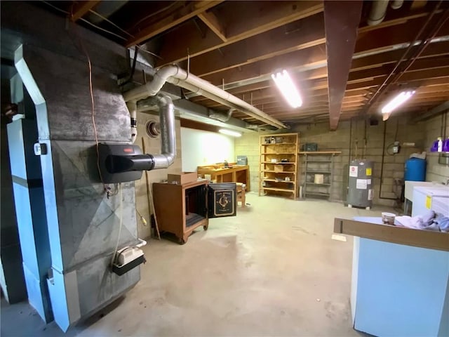 basement with heating unit and electric water heater