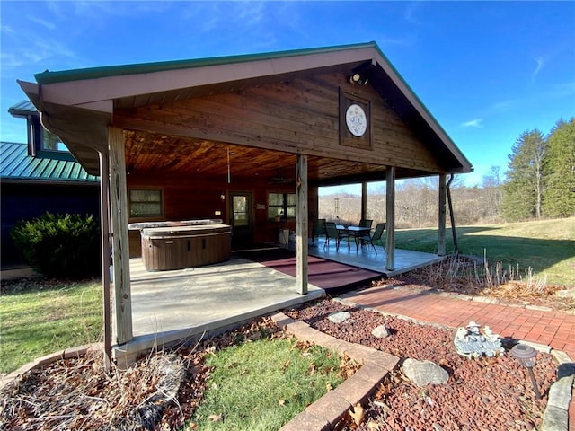 view of patio with a hot tub