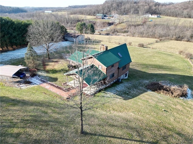 birds eye view of property with a rural view