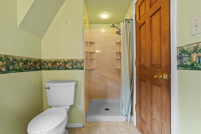 bathroom with toilet and walk in shower