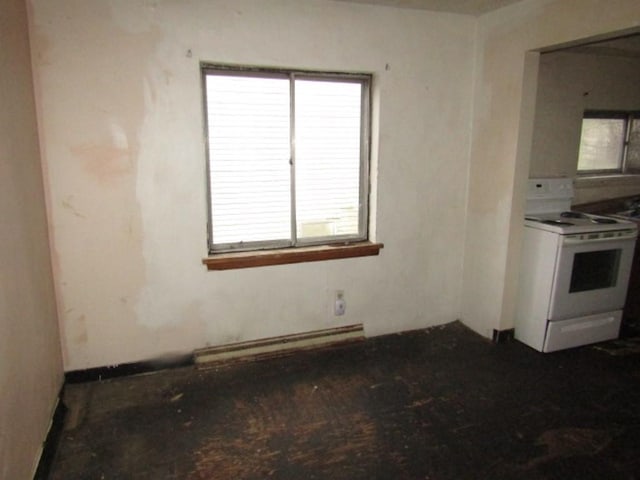 kitchen featuring electric range, plenty of natural light, and a baseboard radiator