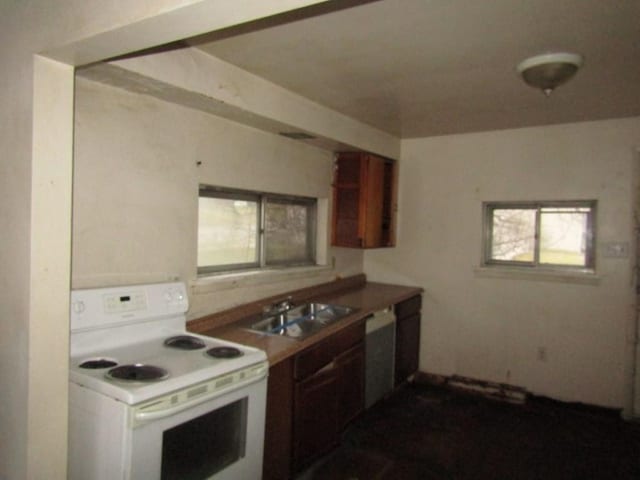 kitchen featuring white appliances and sink