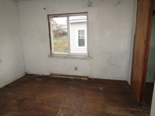 empty room featuring a baseboard radiator