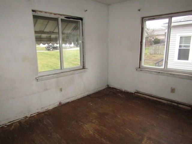 spare room featuring a baseboard heating unit