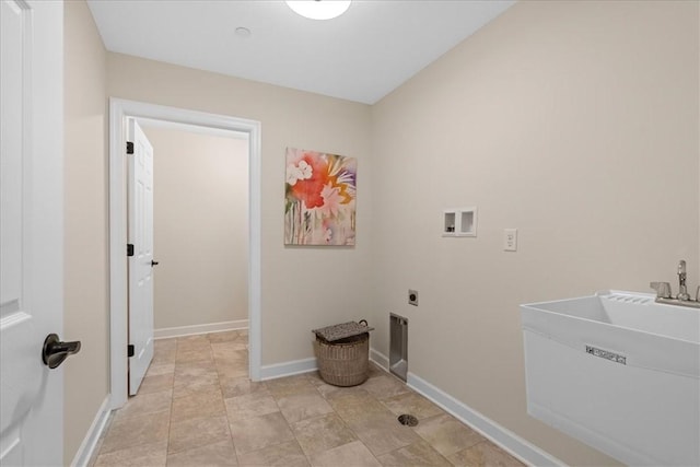 laundry room featuring hookup for a washing machine, electric dryer hookup, and sink