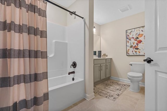 full bathroom featuring tile patterned floors, shower / bath combo with shower curtain, vanity, and toilet