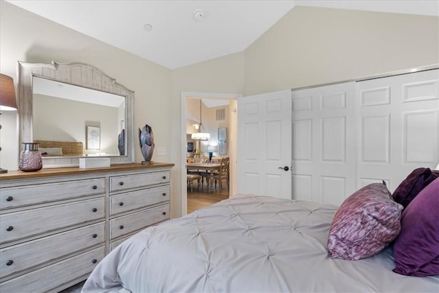 bedroom with a closet and lofted ceiling