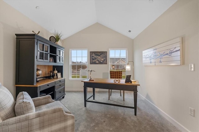 carpeted office with vaulted ceiling