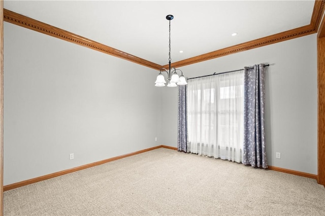 carpeted spare room featuring a chandelier and crown molding