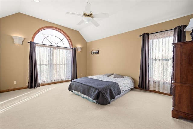 bedroom with carpet floors, vaulted ceiling, and ceiling fan