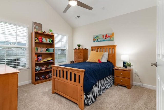 bedroom with ceiling fan, lofted ceiling, and light carpet