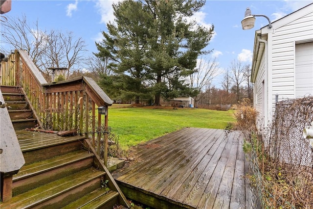 wooden deck with a lawn