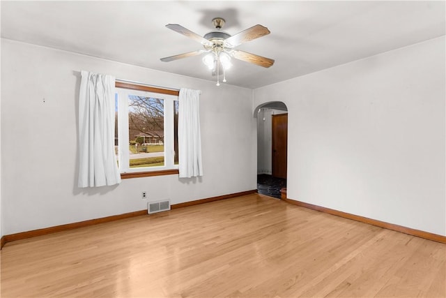 spare room featuring light hardwood / wood-style floors and ceiling fan