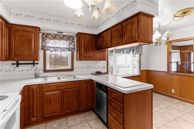 kitchen featuring sink, stainless steel dishwasher, a notable chandelier, stove, and ornamental molding