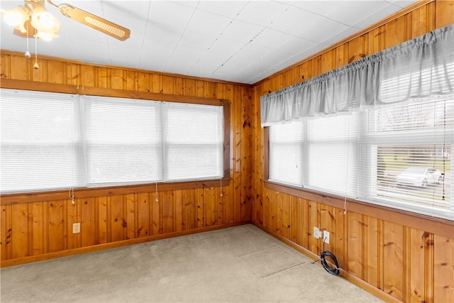 unfurnished sunroom with ceiling fan