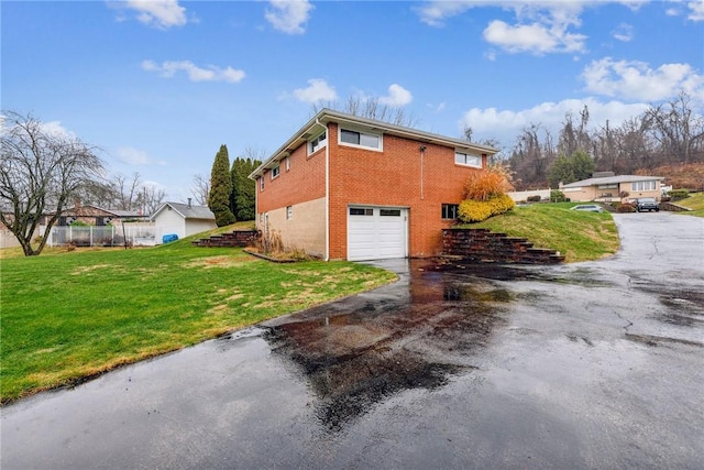 view of property exterior featuring a yard and a garage