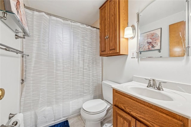 bathroom with tile patterned floors, vanity, and toilet