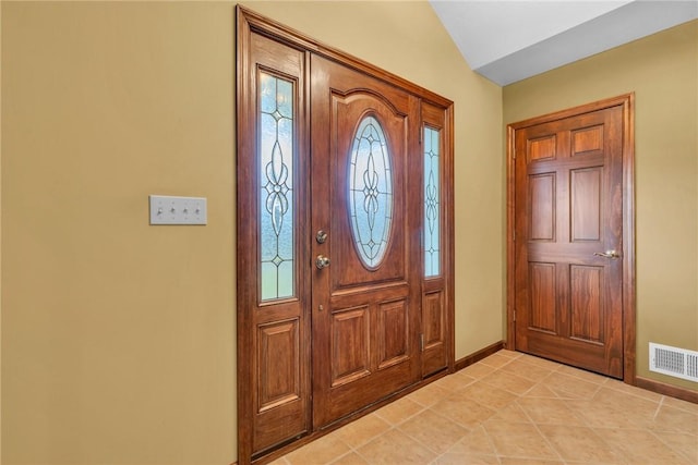 foyer entrance with lofted ceiling