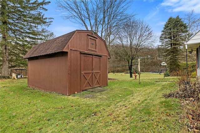 view of outdoor structure with a yard