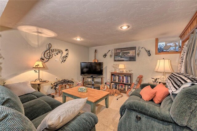 living room featuring carpet flooring and a textured ceiling