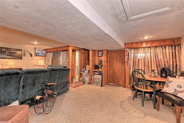 interior space with wooden walls and a textured ceiling