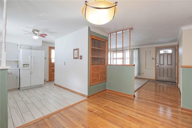 entryway featuring ceiling fan, a healthy amount of sunlight, and light hardwood / wood-style floors