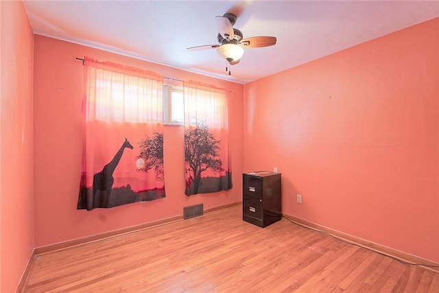 spare room with ceiling fan and light hardwood / wood-style floors