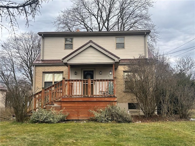 view of property featuring a front lawn