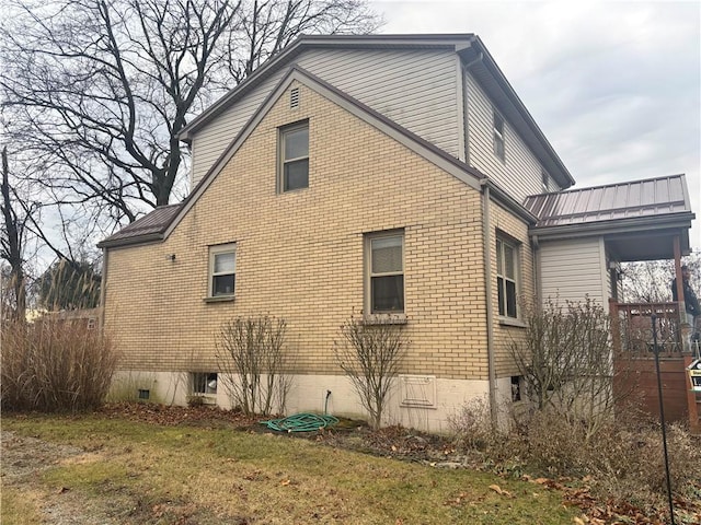 view of side of property with a yard