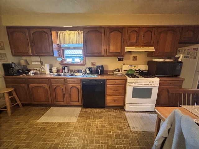 kitchen featuring sink and white appliances