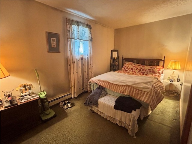 bedroom with carpet flooring and a baseboard heating unit