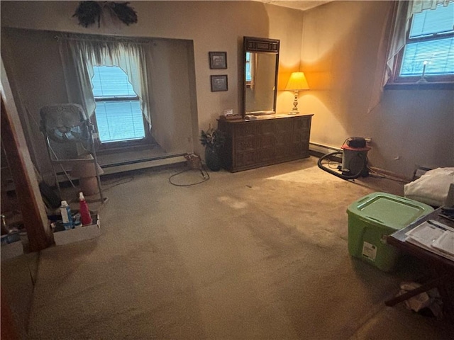 bedroom featuring carpet and baseboard heating