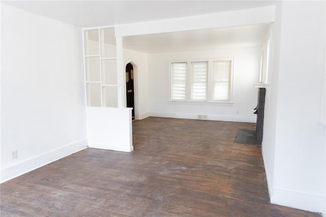 empty room with dark wood-type flooring