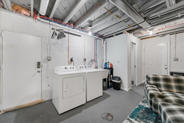 clothes washing area featuring separate washer and dryer