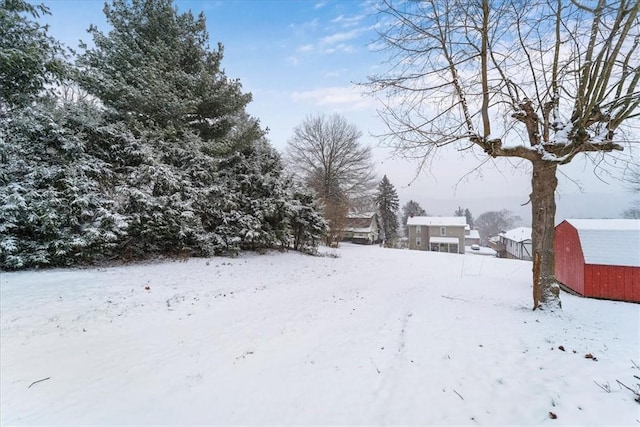 view of yard layered in snow