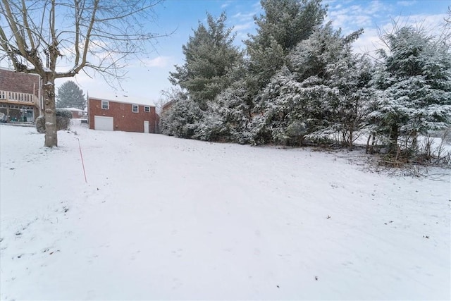 view of yard layered in snow