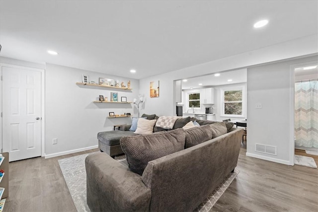 living room with light hardwood / wood-style floors