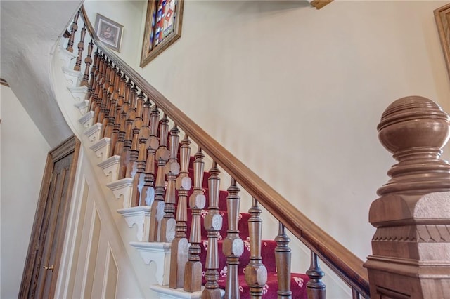 staircase with a towering ceiling