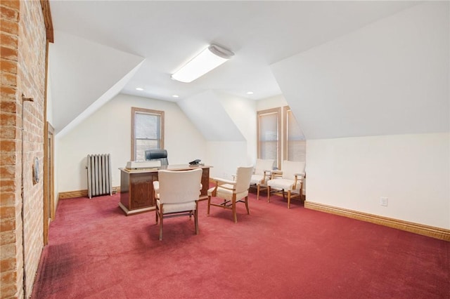 carpeted office space with a fireplace, radiator, and lofted ceiling