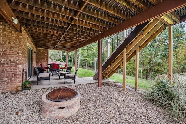 view of patio with a fire pit