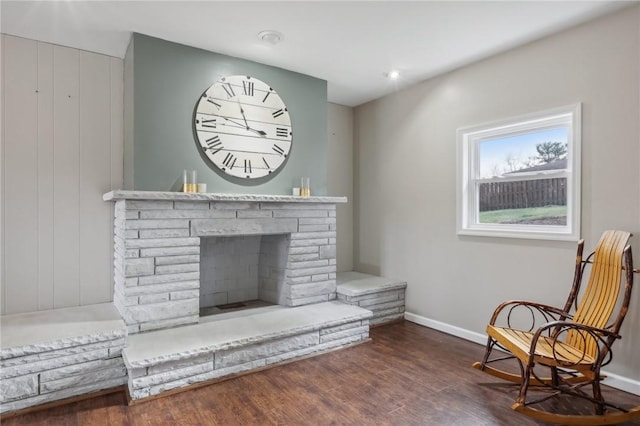 interior space with dark hardwood / wood-style floors and a fireplace