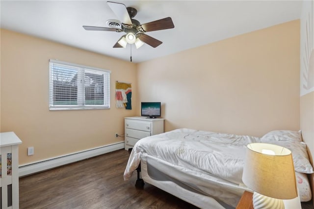 bedroom featuring baseboard heating, dark wood-type flooring, and ceiling fan