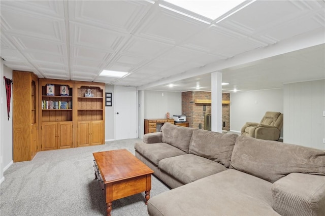 carpeted living room with a brick fireplace