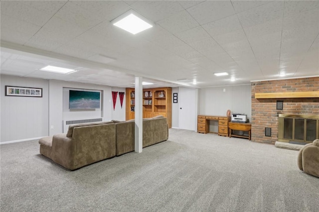 unfurnished living room featuring a fireplace and carpet