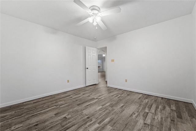 spare room featuring ceiling fan and hardwood / wood-style flooring