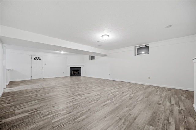 unfurnished living room with light hardwood / wood-style flooring